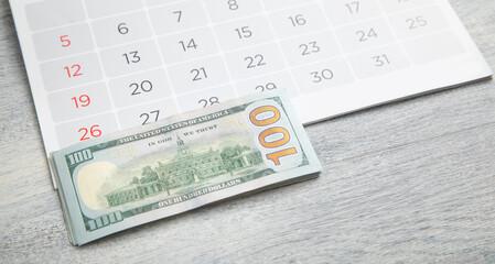 Dollar banknote on calendar. Business