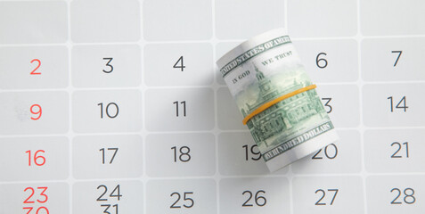 Dollar banknote on calendar. Business