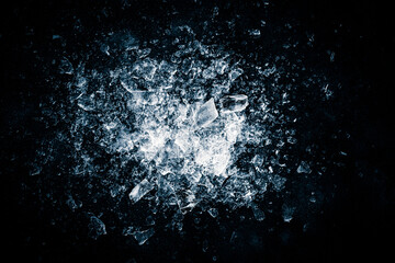 Ice, crushed on a black background. Shards of crushed ice spreading away. The explosion of ice. - 764720120