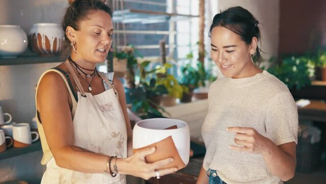 Women, pottery studio and talking or clay art design for small business, shop service or customer. Startup owner, client and craft ceramic skill or conversation of diy pot, talent or handmade ideas