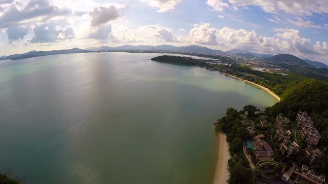 Aerial Panning Scenic View Of The Westin Siray Bay Resort And Spa By Rippled Sea Under Cloudy Sky - Krabi, Thailand