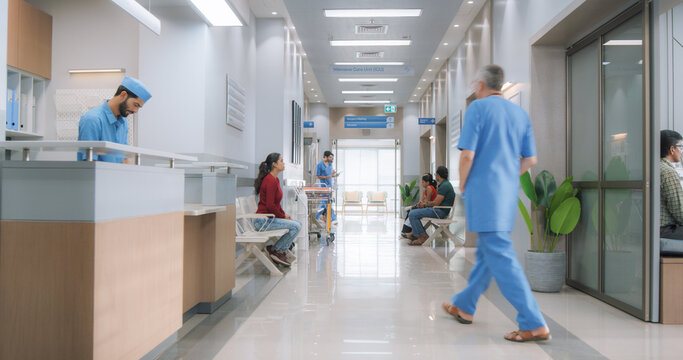 Establishing Shot of Active Local Indian Health Clinic Lobby, Representing Modern and Advanced Healthcare Services with Nurses and Doctors. Diverse Patients Waiting in Reception Hall in a Hospital