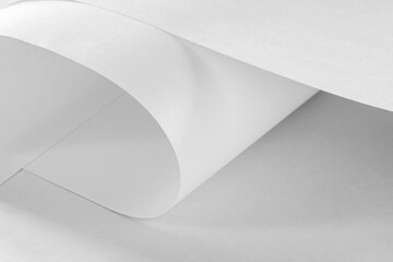 Large long sheets of white paper in black and white as a background.