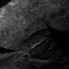 Black white rock texture. Dark stone background with copy space for design. Web banner. Website header.