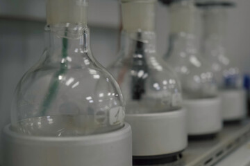 Glass flasks in laboratory. Chemical Analyses