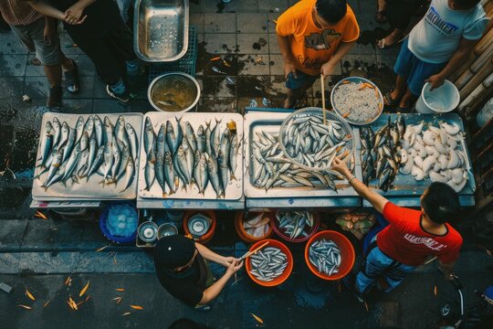 Vietnam traditional fish market people selling fresh fish on the sidewalk