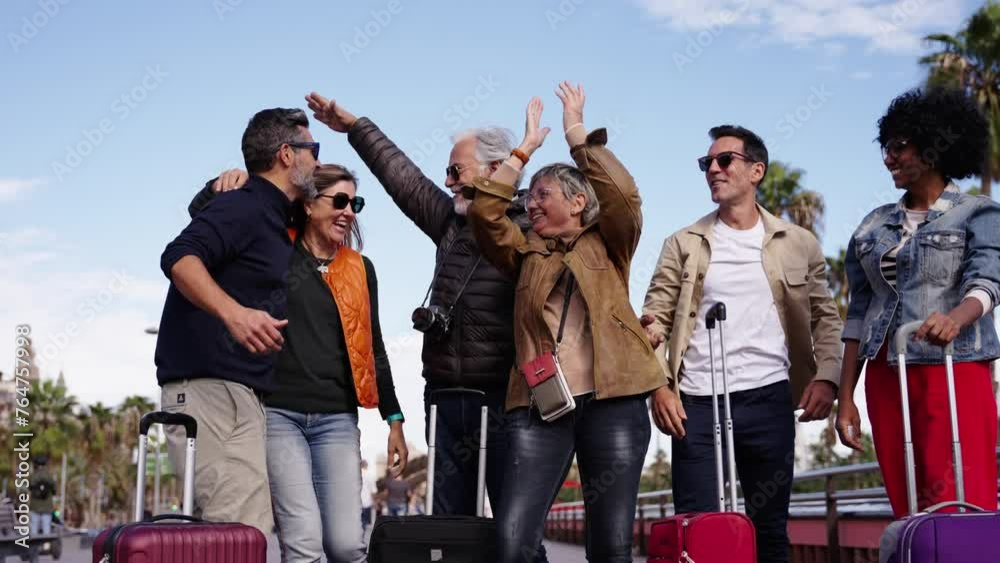 Wall mural group of middle aged excited friends posing for the camera happily celebrating their holidays. diver