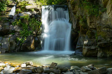 Beautiful view of the Zaskalnik waterfall in the Pieniny Mountains. Szczawnica. Long exposure. - 764771153