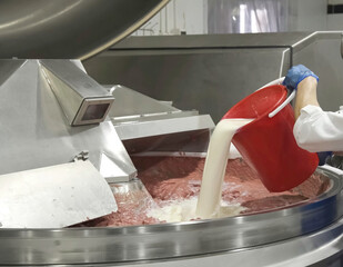 Preparation of minced meat at meat processing plant. Raw materials for sausages and sausages.