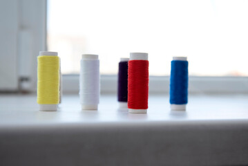 Spools of the colored thread	