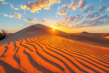 Fototapeta na wymiar Sun Setting Over Sand Dune