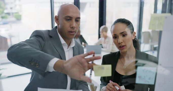 People, scrum or glass board with writing by tablet brainstorming, thinking and project management in office. Collaboration, planning or sticky notes post on wall for creative strategy or workplace