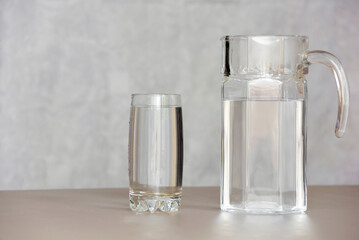 Water in a glass in close-up on a white background. Health. Drink water.