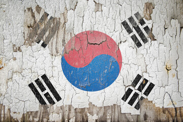 South Korea flag painted on the cracked wall