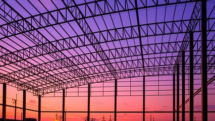 Silhouette of industrial building structure with curved metal roof beam outline and column in...