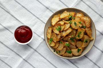 Homemade Roasted Garlic Parmesan Potatoes on a Plate, top view.