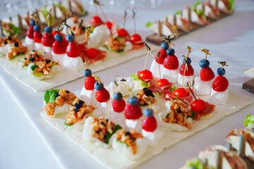 Buffet. Various canapes on banquet trays. Catering services.
