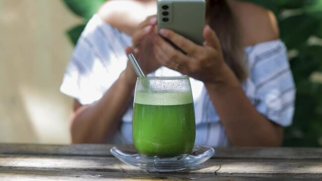 taking a picture of a mint smoothie glass. 
