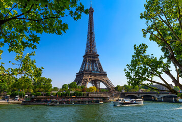 View of Eiffel Tower and river Seine in Paris, France. Eiffel Tower is one of the most iconic landmarks of Paris - 764828741
