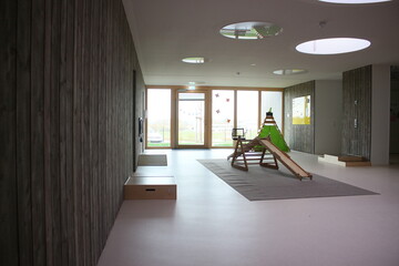 Image of a kindergarten premises, wooden slide.