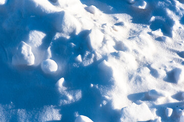 A snow pile formed by shoveling snow after winter snowfall