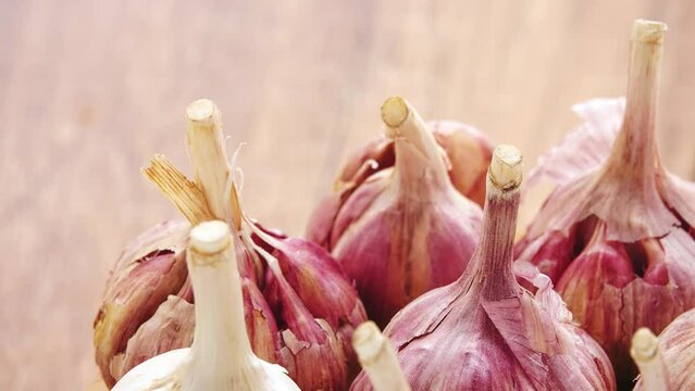 Gyration old garlic on a wooden table background.