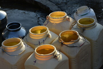 Cans in the village depicting water poverty