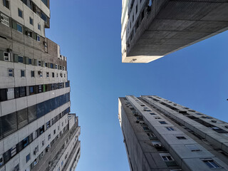 Fototapeta na wymiar Architecture, low angle view to the top and sky as a backdrop blue