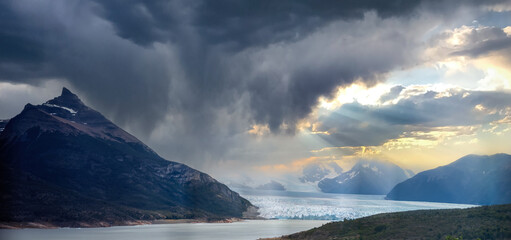 Majestic Glacier and Mountain Landscape Under Stormy Skies
