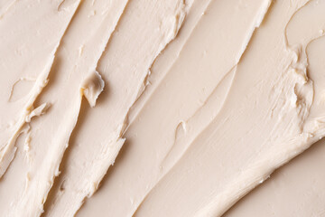 Close-up view of a textured beige cosmetic clay