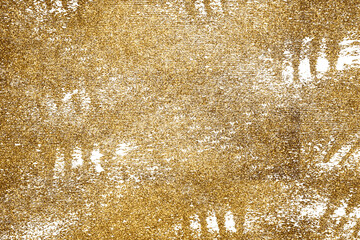 Golden paint brush stroke glittering texture.