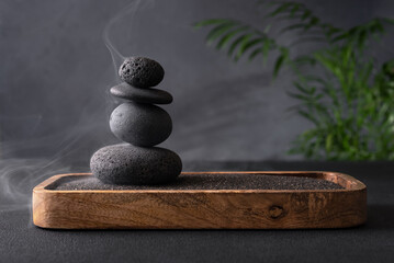 Serene stack of smooth grey stones balanced in a zen-like arrangement