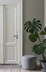 Sun-drenched living room with lush monstera plant: a combination of elegance, comfort and natural beauty