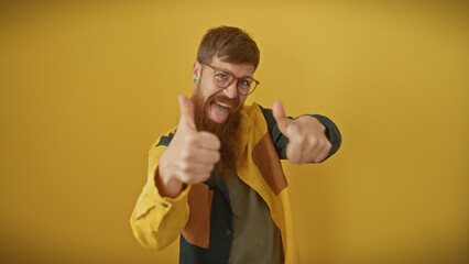A happy man with a beard and glasses giving thumbs up against a yellow background.