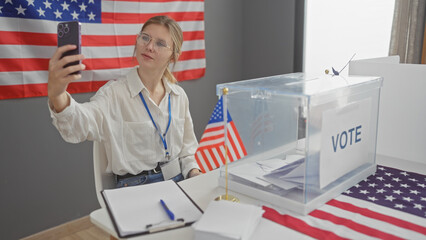 Young woman taking a selfie at a usa voting center, with ballot box and american flag in foreground