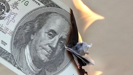one hundred bill burning 