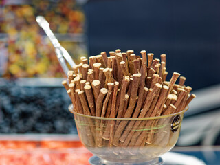 Licorice sticks, detail of fresh licorice sticks, craft sale in a market