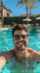 A man is taking a selfie in a pool
