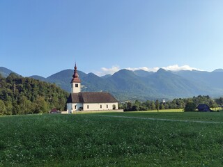 Rustic white church in the mountains - Slovenia, Triglav National Park