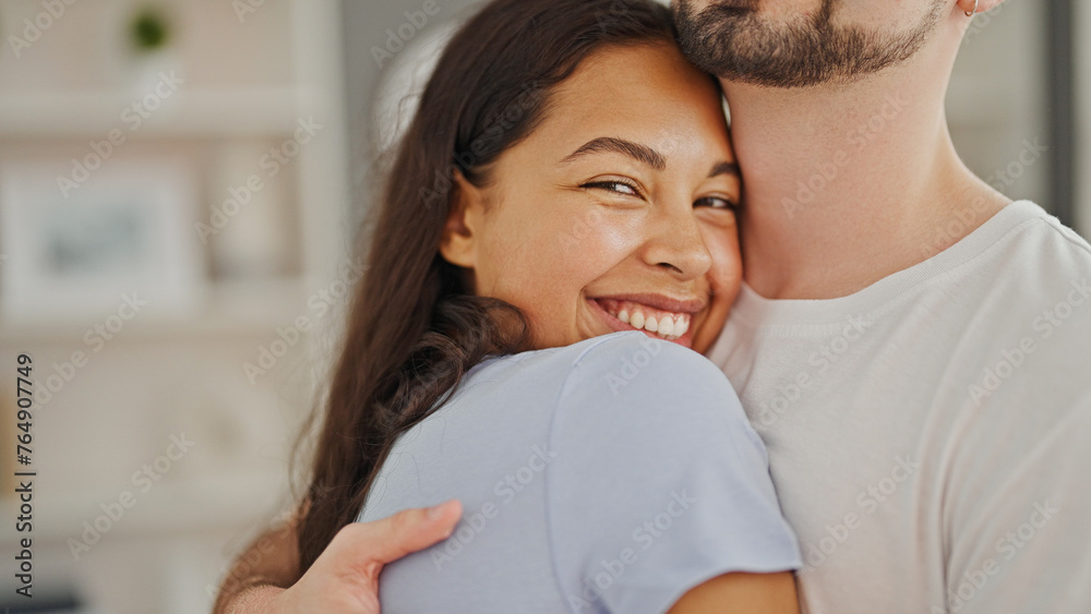 Sticker Beautiful couple hugging each other standing together smiling at home