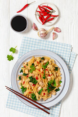 rice noodles with chicken, eggs, chinese broccoli