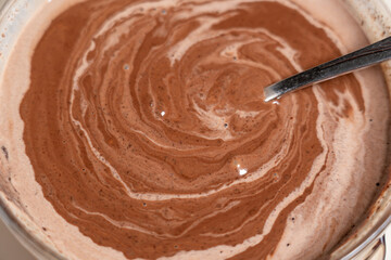 Making sauce with melting chocolate and thickened cream. Cooking Salted Caramel Chocolate Cold Cake Series.