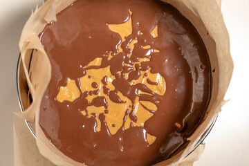Pour chocolate sauce over cookies cake base with caramel layer. Cooking Salted Caramel Chocolate Cold Cake Series.