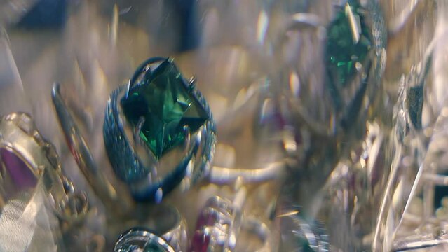 Beautiful shiny, sparkling golden jewelry with glare in gems. Macro. Closeup. Shallow depth of field