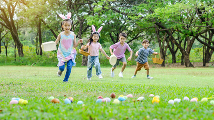 Children having fun in park, Kids holding baskets in their hands Then run in a race to hunt for...