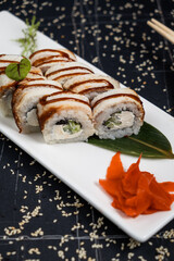 Green dragon sushi roll with eel, avocado, cucumber, wasabi and ginger.