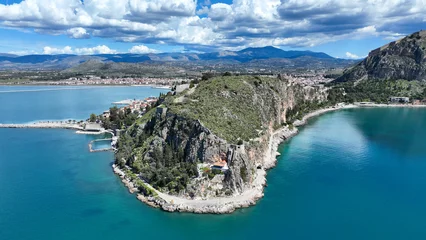 Foto op Canvas Aerial drone photo of iconic Acronafplia fortress overlooking old city of Nafplio below famous castle of Palamidi as seen in a spring morning with beautiful clouds and deep blue sky, Argolida, Greece © aerial-drone