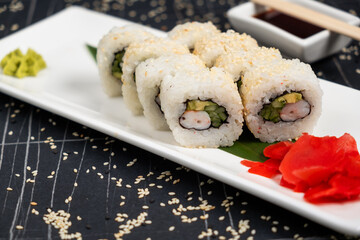 Sushi roll sushi with prawn, avocado, cream cheese, sesame. Sushi menu. Japanese food.