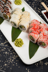 Different rolls background. Traditional sushi. Delicious japanese food.