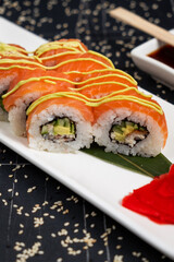 Sushi roll red Dragon on black background